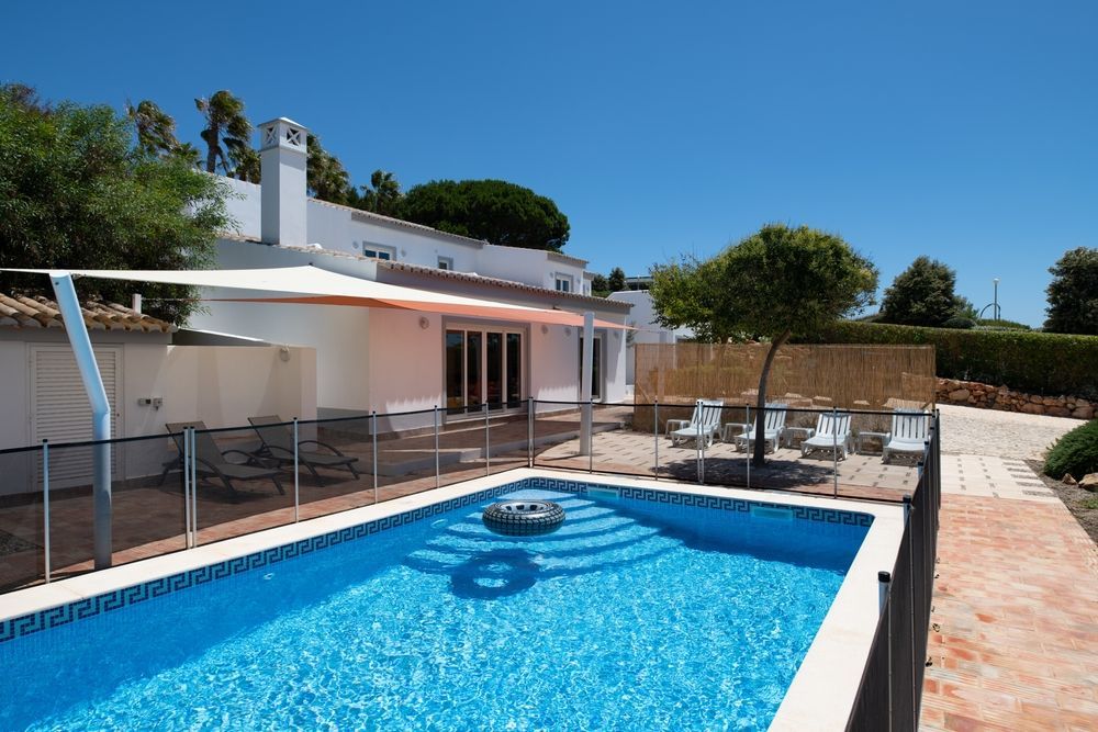 Poolside View of a White Villa With a Blue Pool — East Coast Pool Resurfacing In Newcastle, NSW