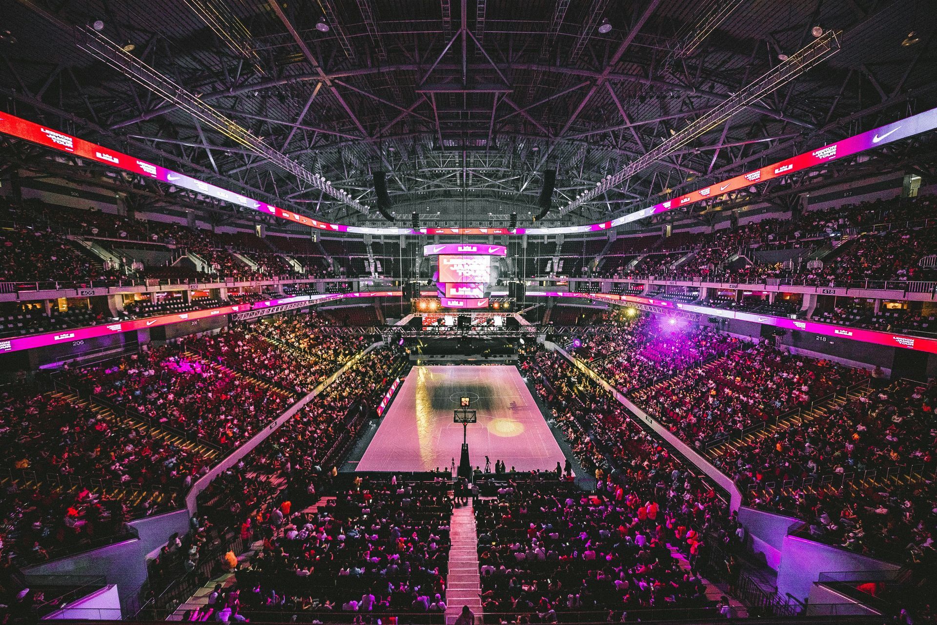 A crowded arena with vibrant lights