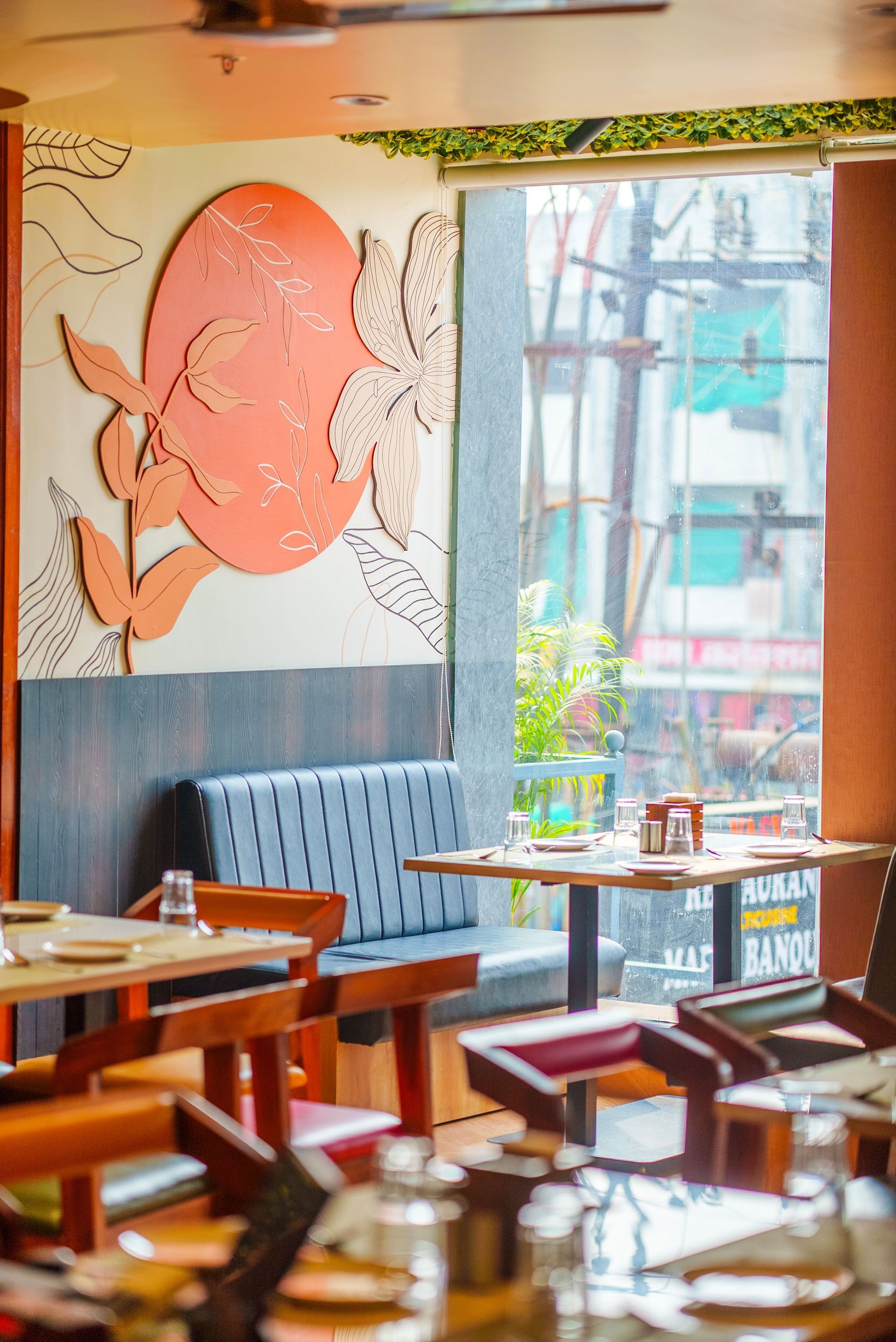 A vibrant mood inside a restaurant with unoccupied tables