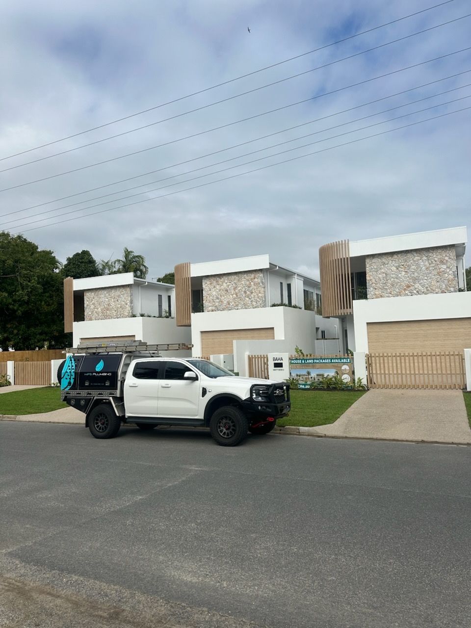 Public Restroom With White Tiled Walls — HFB Plumbing & Gas in Wrights Creek, QLD
