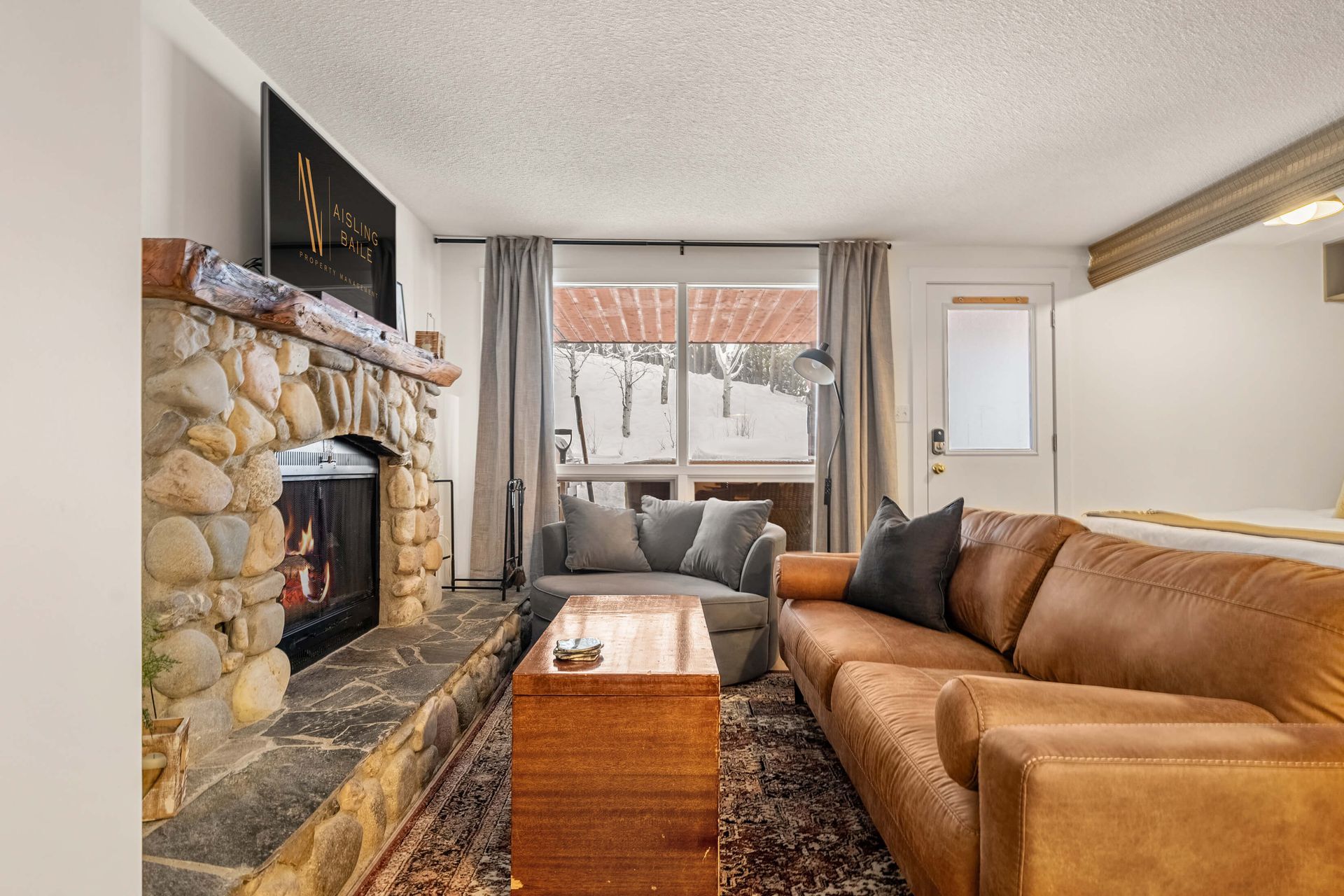 Living room of the Apres Adventure, a ski-in/ski-out Panorama BC Vacation Rental hosted by Aisling Baile Property Management.