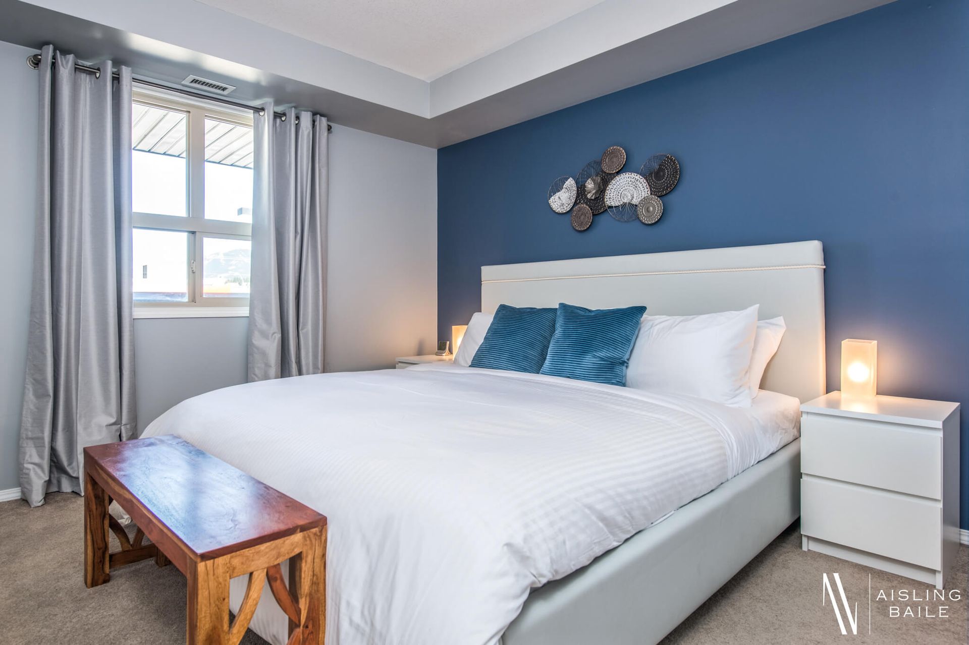 Primary bedroom of of this Trendy Lake Windermere Pointe BC Vacation Rental hosted by Aisling Baile Property Management.