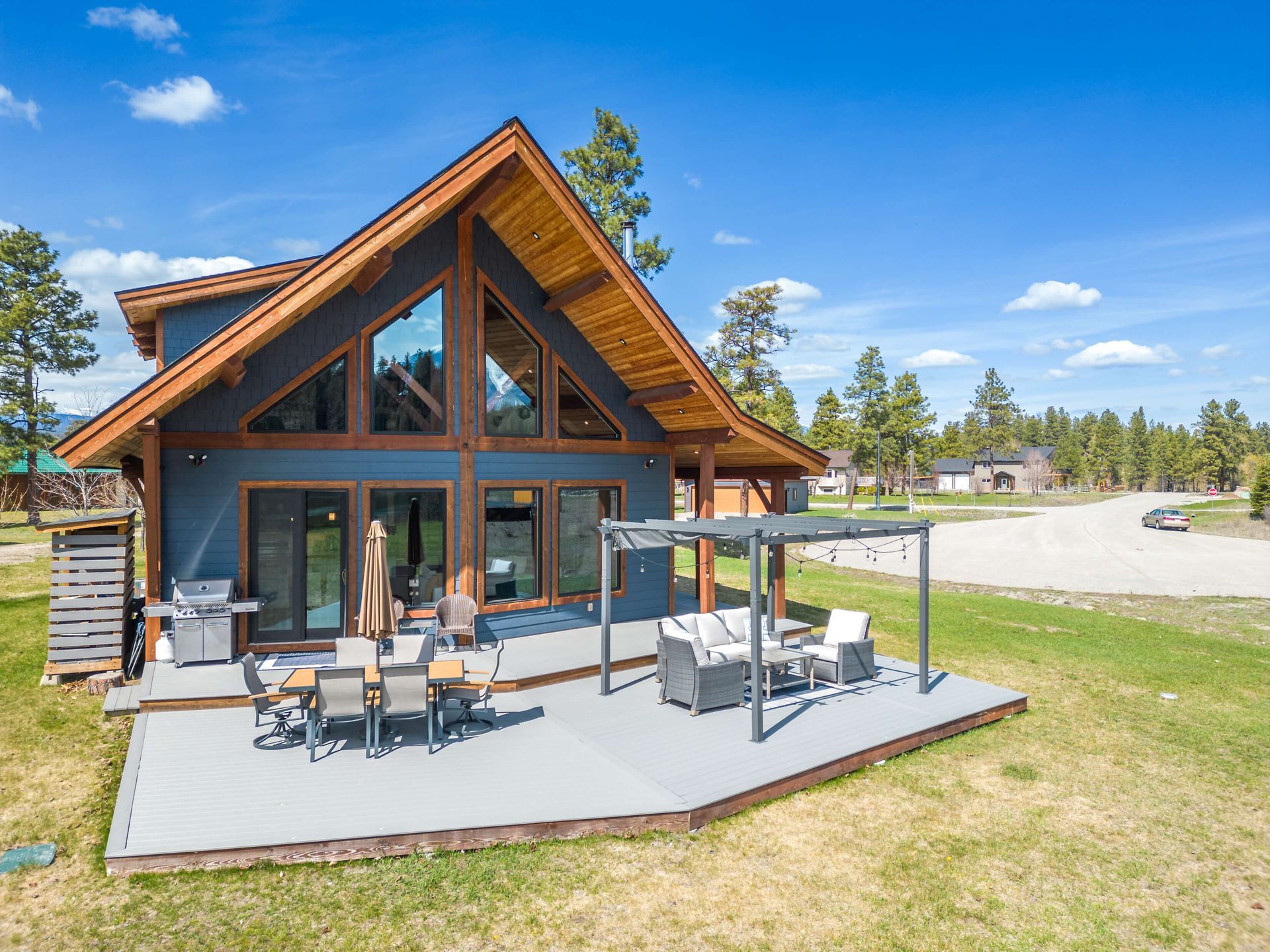 A large house with a large patio in front of it.