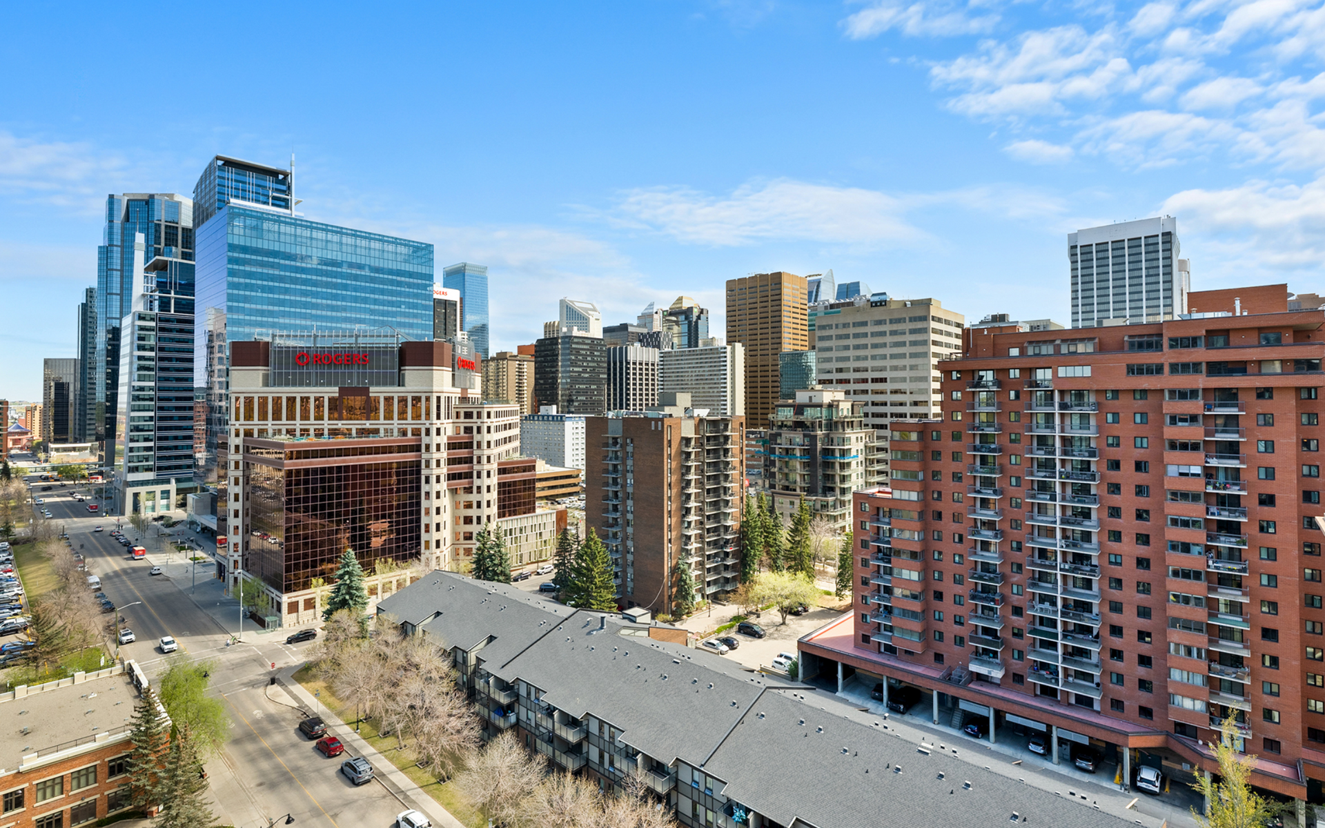 Downtown Calgary views from a corner-unit balcony. 