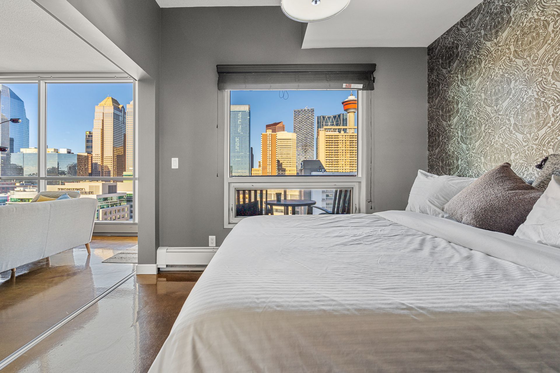 Primary bedroom of All My Fave Colours a Calgary short-term rental hosted by Aisling Baile Property Management.