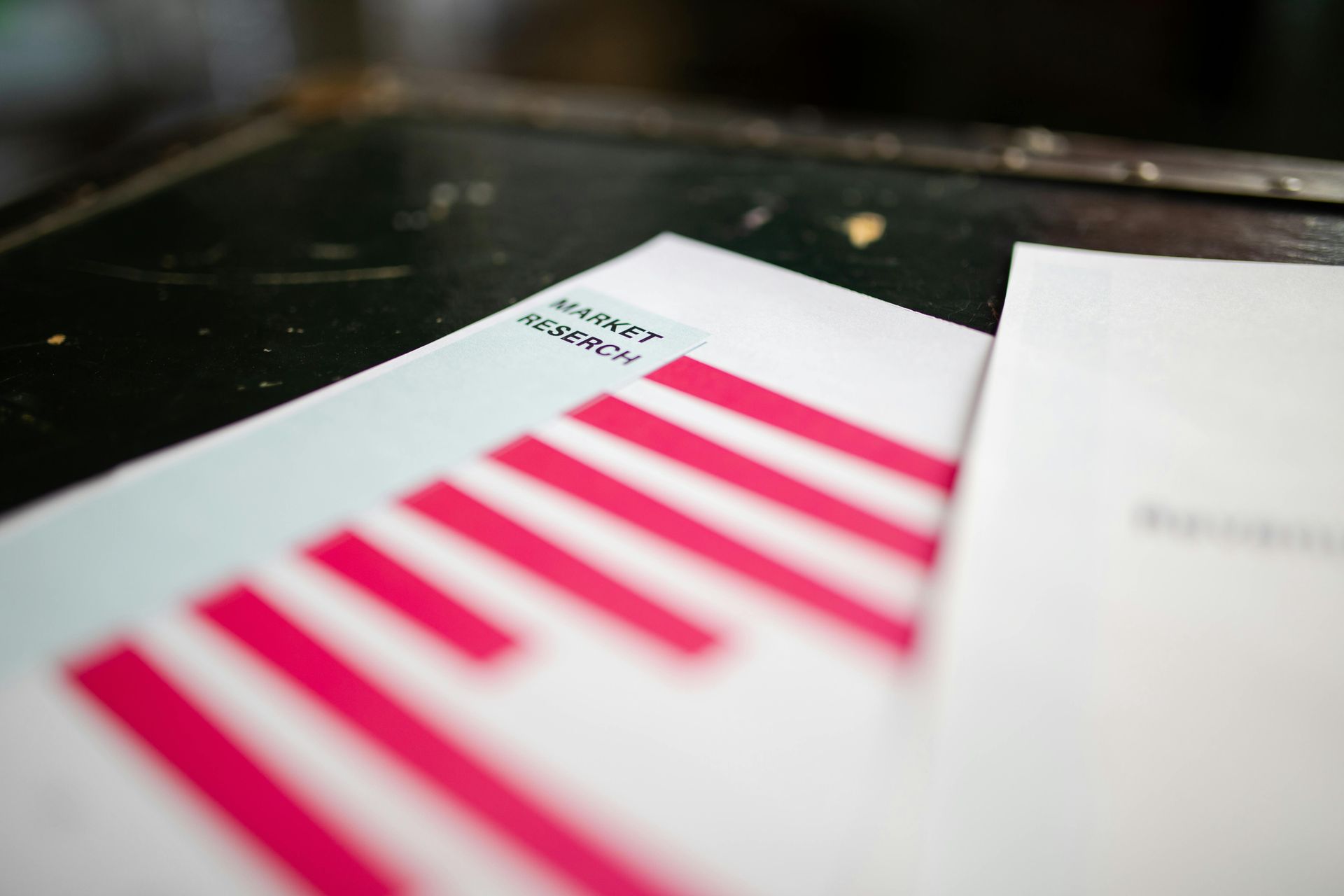 White paper with red bar graph, and 