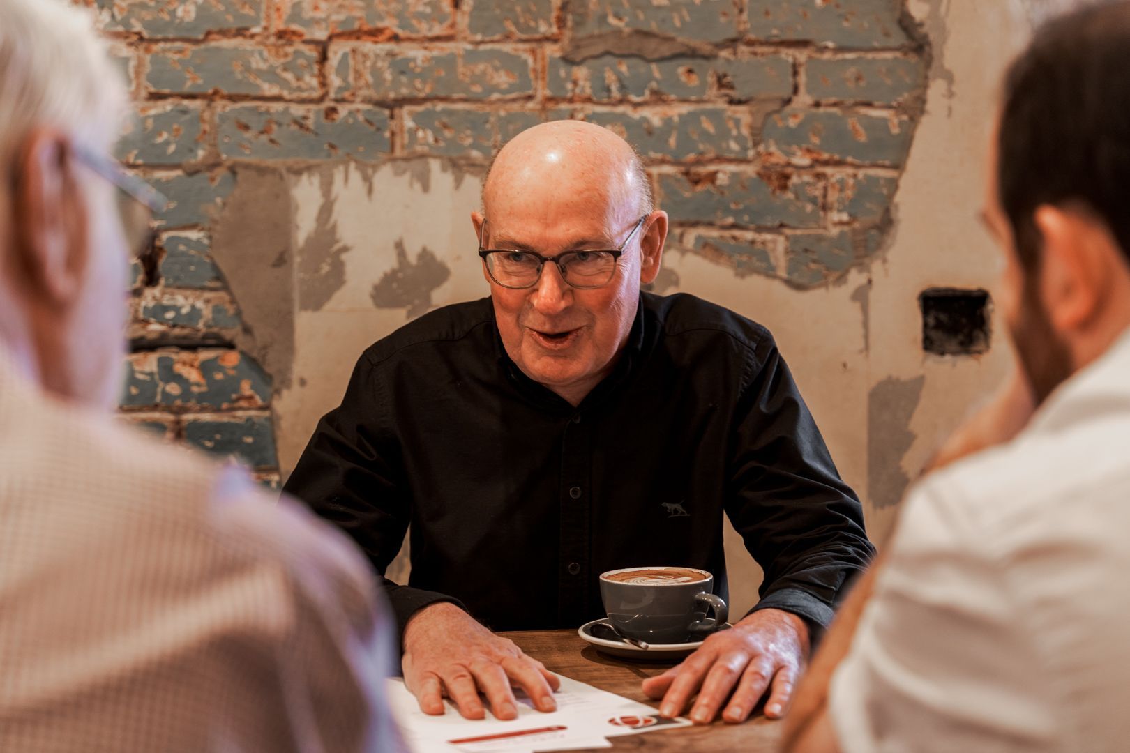 Man with coffee at a coffee shop