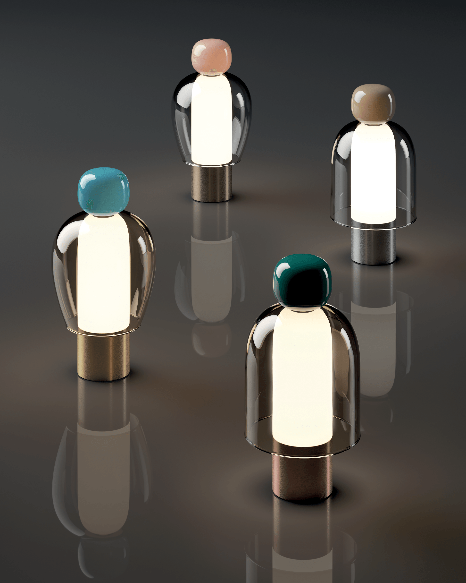 Cuatro lámparas de diferentes colores están sentadas sobre una mesa.
