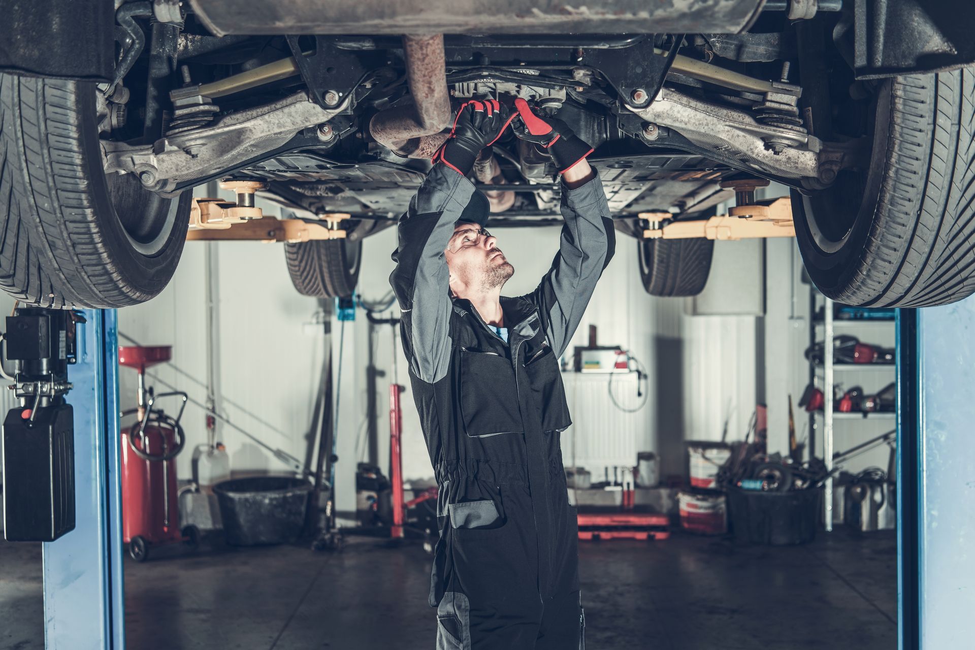 Technician doing maintenance work | Family AutoCare & Repair