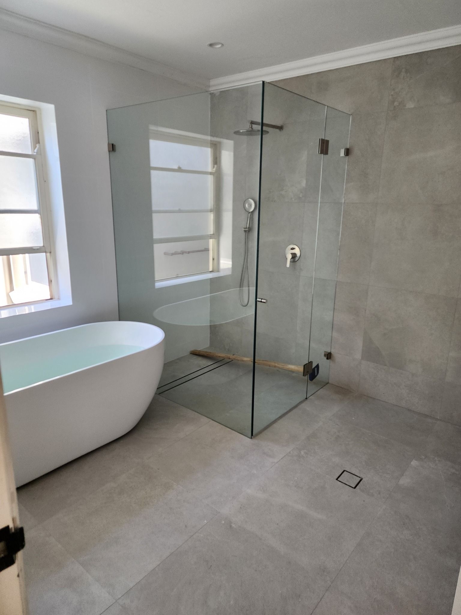 A Bathroom With A Bathtub And A Walk In Shower — Renovate A Space In Toukley, NSW