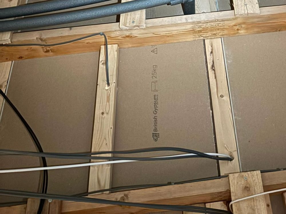 First fix electrical cabling run through timber joists before boarding