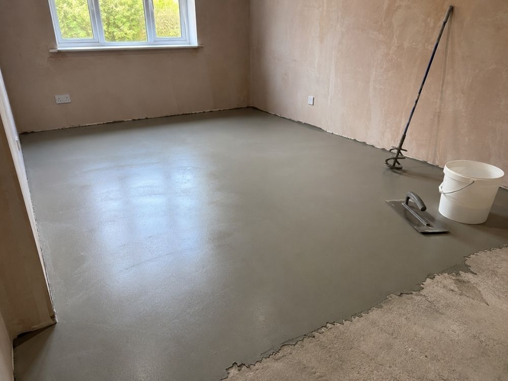 Self-levelling screed applied to a subfloor before flooring is laid