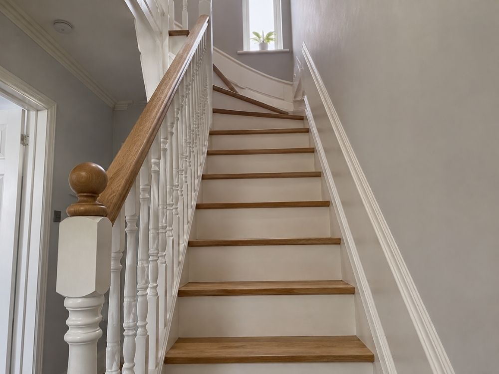 Renovated staircase with turned spindles, oak handrail and stripped treads in a Victorian terrace