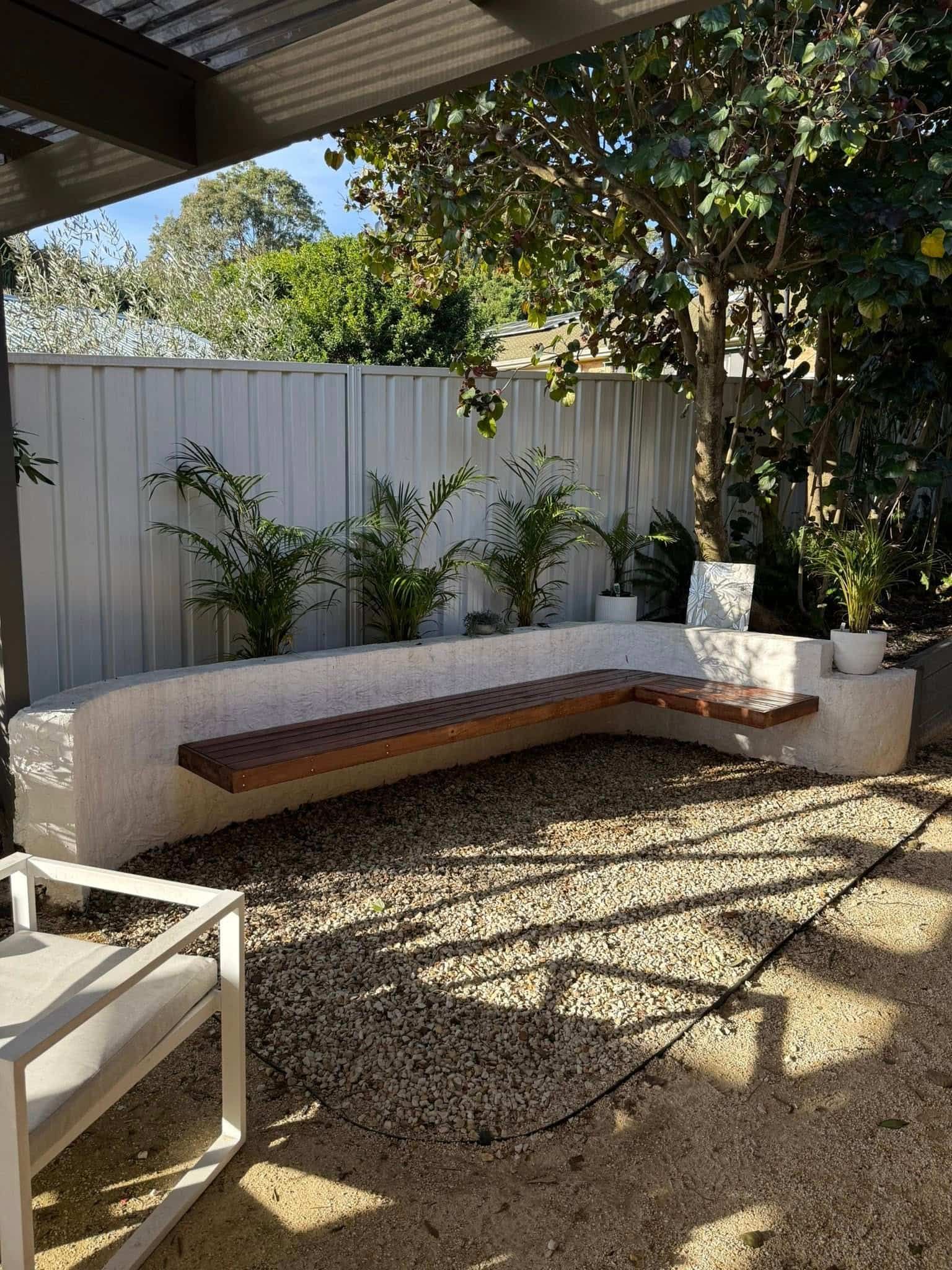 Covered Patio With Curved White Bench — Tyrone Building Solutions in Anna Bay, NSW