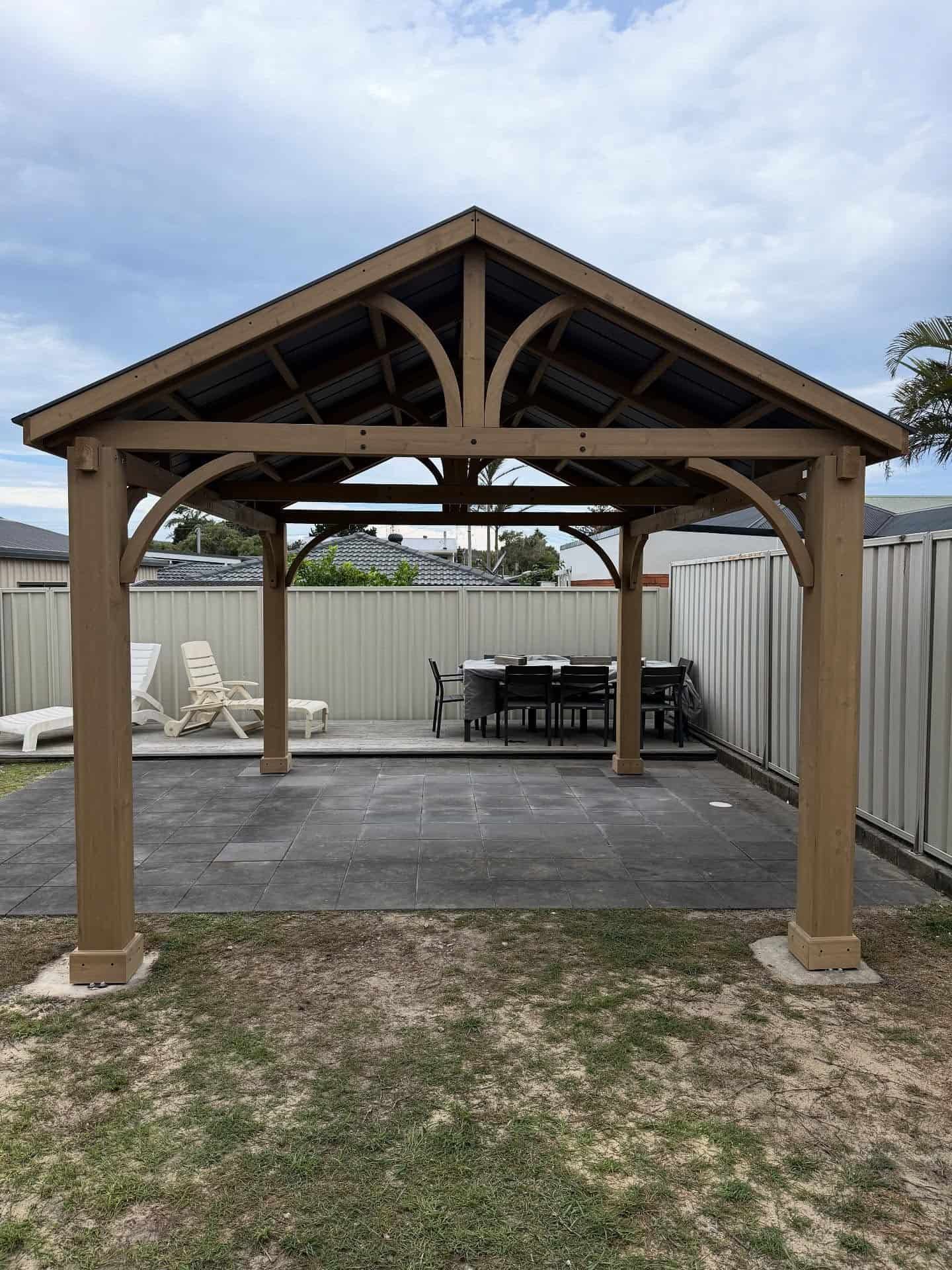 Wooden Backyard Gazebo With a Gray Stone Floor — Tyrone Building Solutions in Anna Bay, NSW