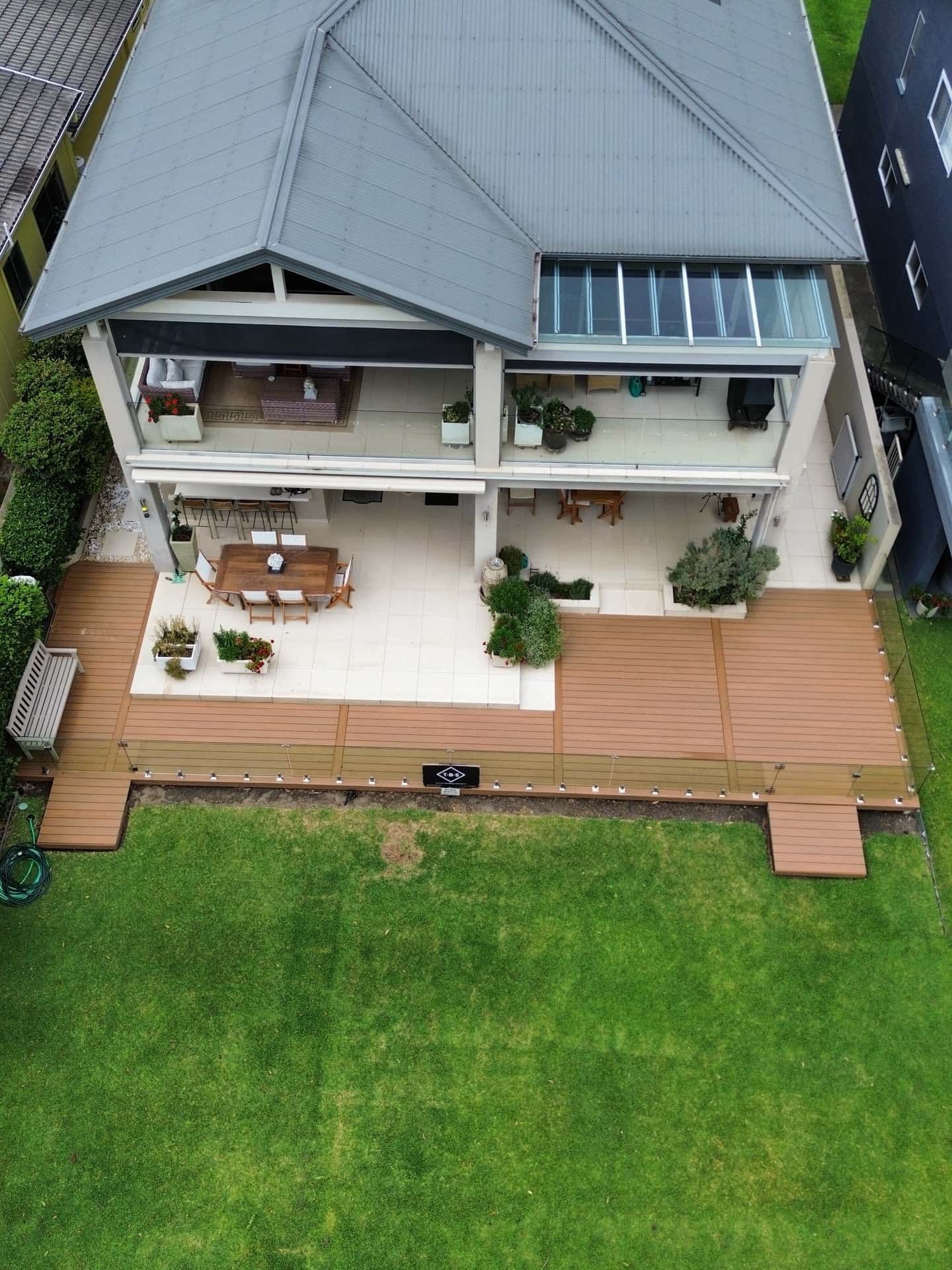 Aerial View of a House With a Large Wooden Deck — Tyrone Building Solutions in Anna Bay, NSW