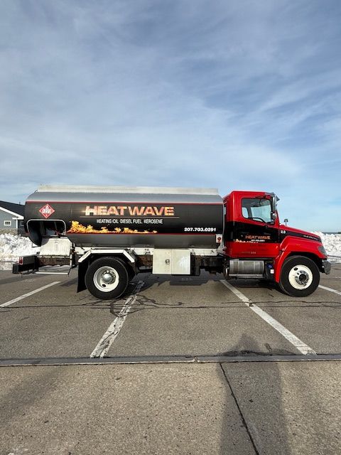 A red and black fuel truck labeled