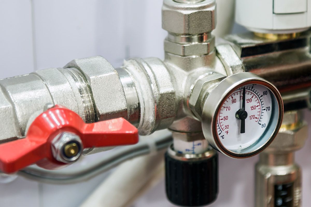 Pressure Gauge and Red-handled Valve — One Flush Plumbing Service In Pimpama, QLD