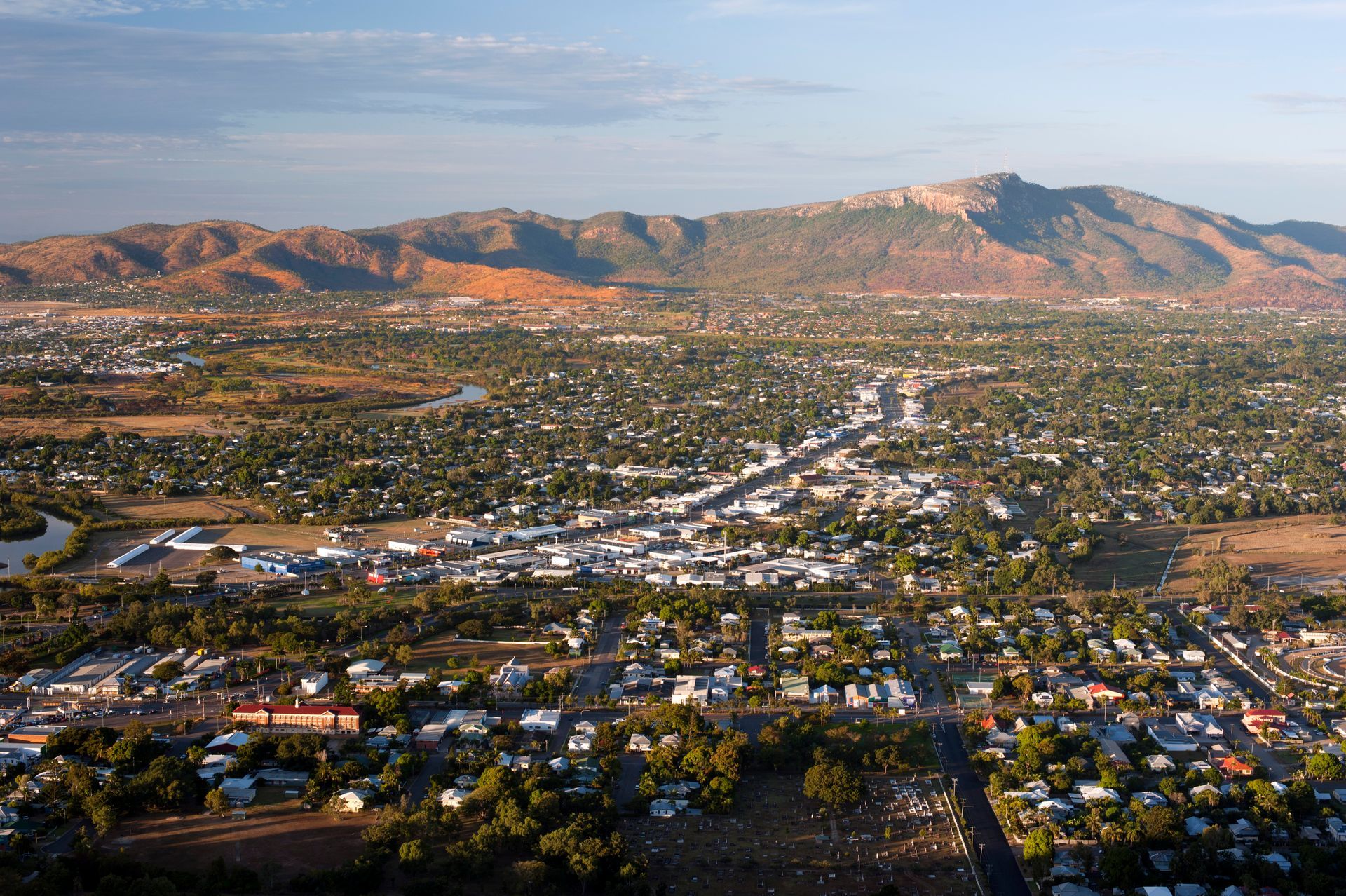 Aerial View of a City at Sunset — One Flush Plumbing Service In Maudsland, QLD