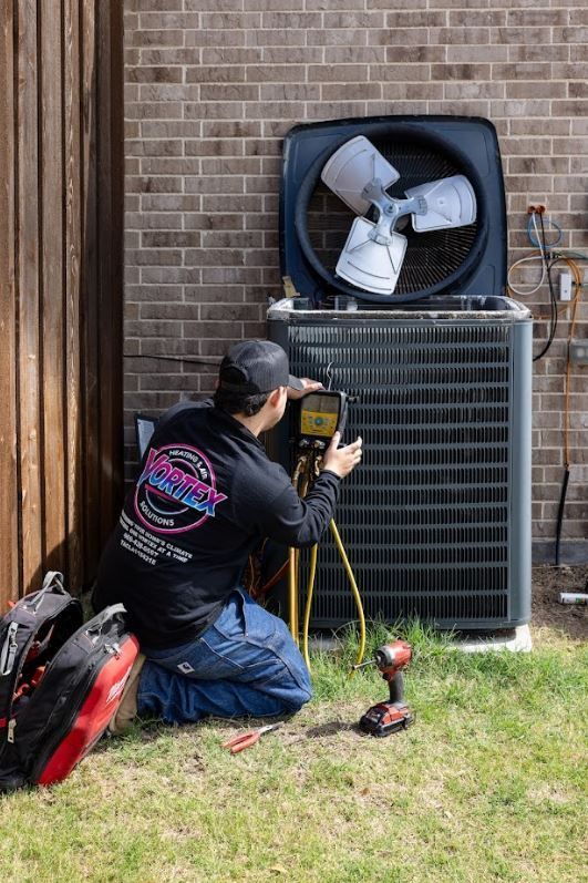 Vortex HVAC technician performing preventative air conditioning maintenance inspection in Texas.