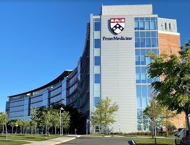 A large building with the word penn medicine on it