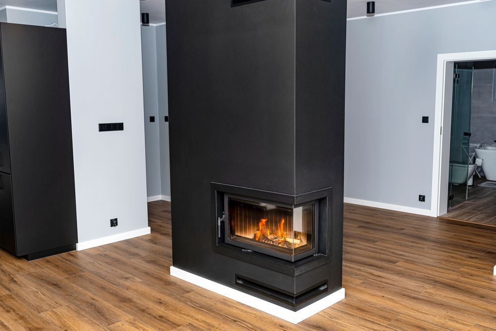 Living Room Featuring a Floor-to-ceiling Fireplace — Complete Heating In Huntingfield, TAS