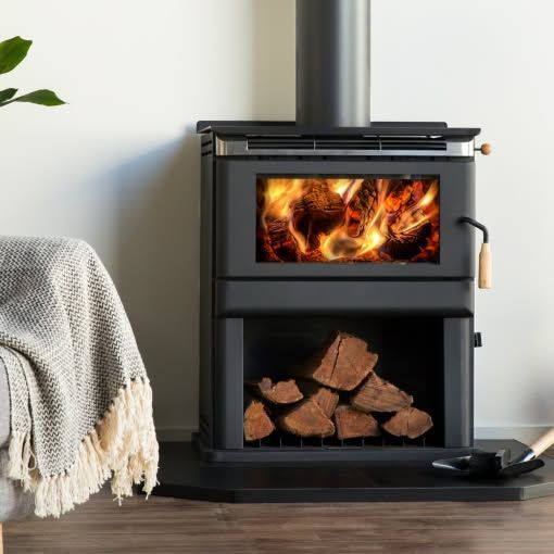 A Black Wood-burning Stove With a Lit Fire in the Upper Chamber — Complete Heating In Hobart, TAS