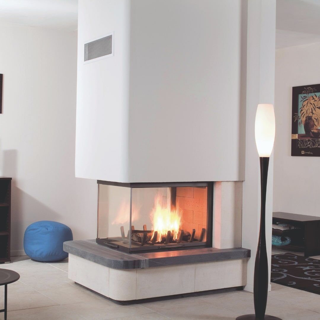 Modern Living Room With a Lit Corner Fireplace — Complete Heating In Huntingfield, TAS