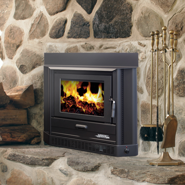 Black Wood Stove With Fire Burning in a Stone Fireplace — Complete Heating In Huntingfield, TAS