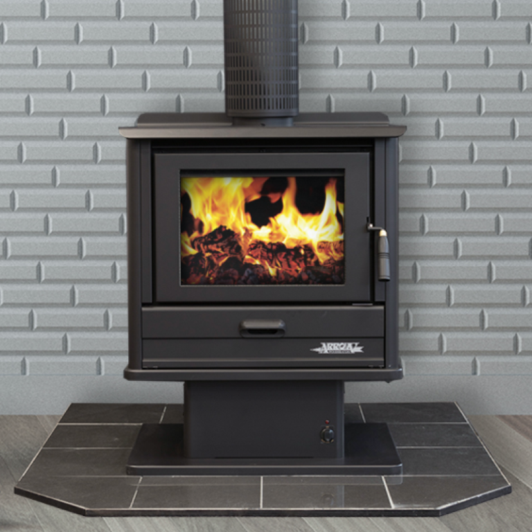 Black Wood-burning Stove With Visible Flames on a Tiled Hearth — Complete Heating In Huntingfield, TAS