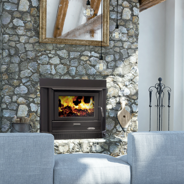 Stone Fireplace With a Burning Fire is Set in a Living Room — Complete Heating In Huntingfield, TAS