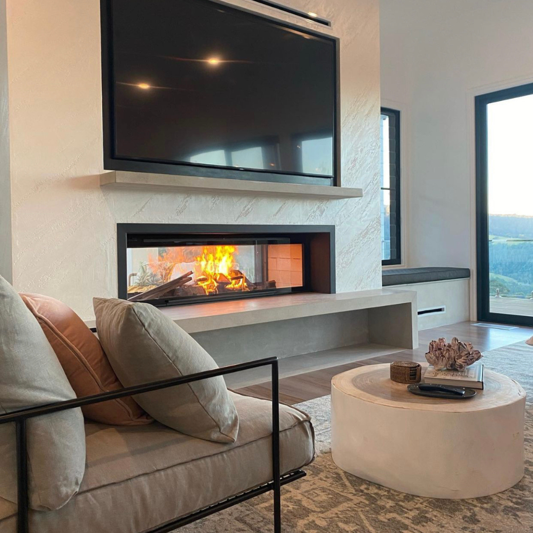 Modern Living Room With Wall-mounted TV and Lit Fireplace — Complete Heating In Huntingfield, TAS