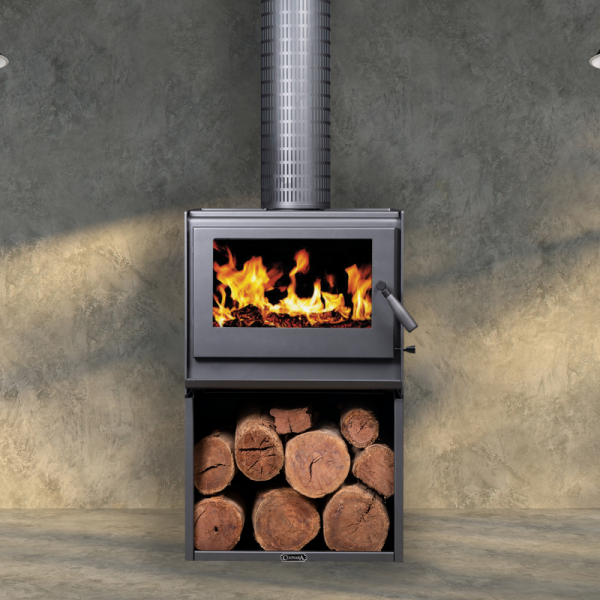 Wall-mounted Black Wood Stove With Flames Visible and Stacked Logs Below — Complete Heating In Huntingfield, TAS