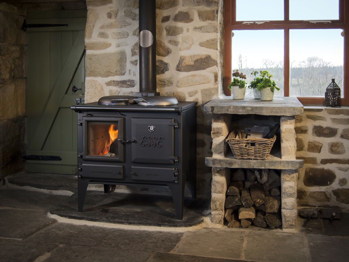Wood-burning Stove Heating a Rustic Stone Kitchen — Complete Heating In Huntingfield, TAS