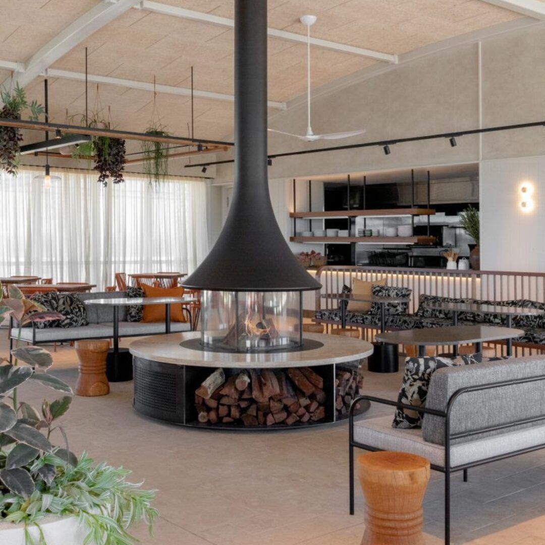 Modern Lounge With a Central Black Fireplace — Complete Heating In Huntingfield, TAS