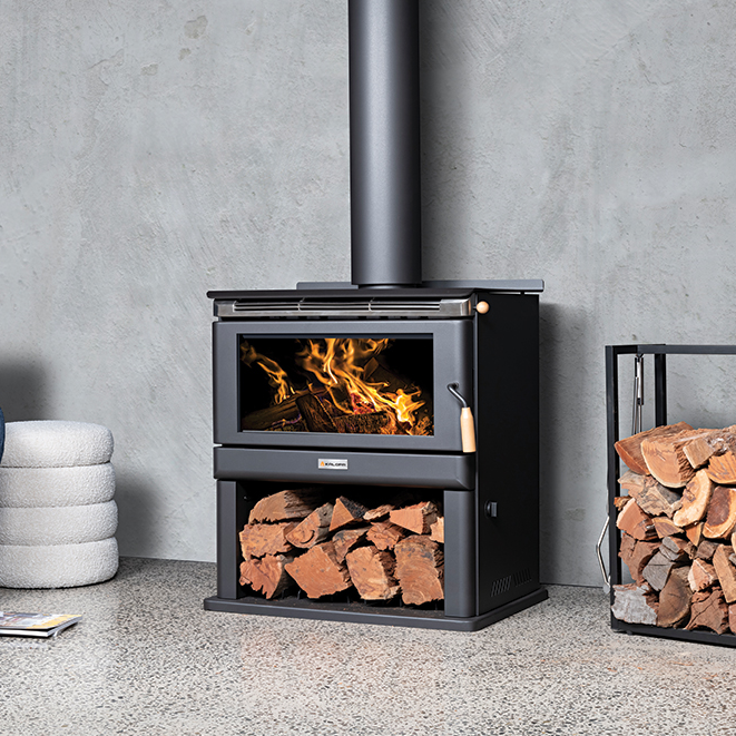Wood Stove With Fire Burning, Stacked Logs Below — Complete Heating In Huntingfield, TAS