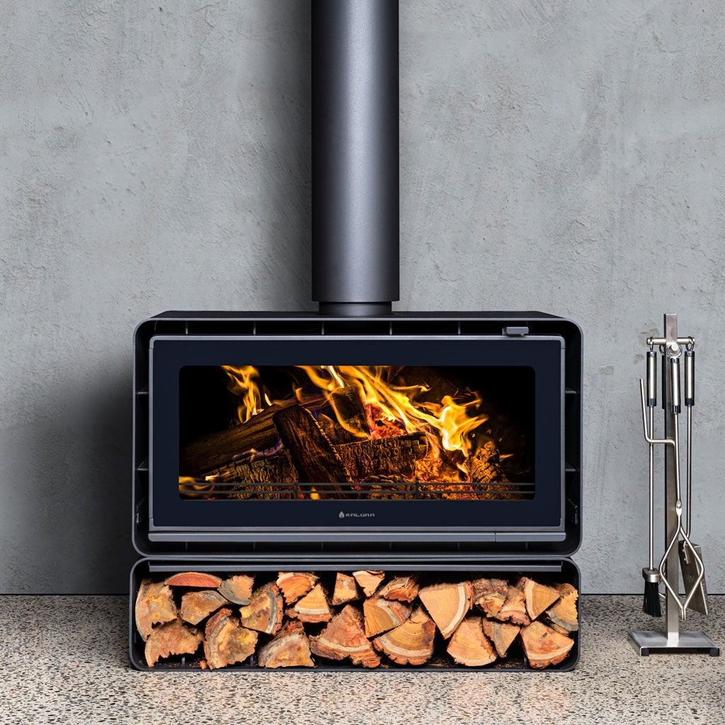 Modern Black Wood Stove With Visible Flames, Stacked Firewood Below — Complete Heating In Huntingfield, TAS