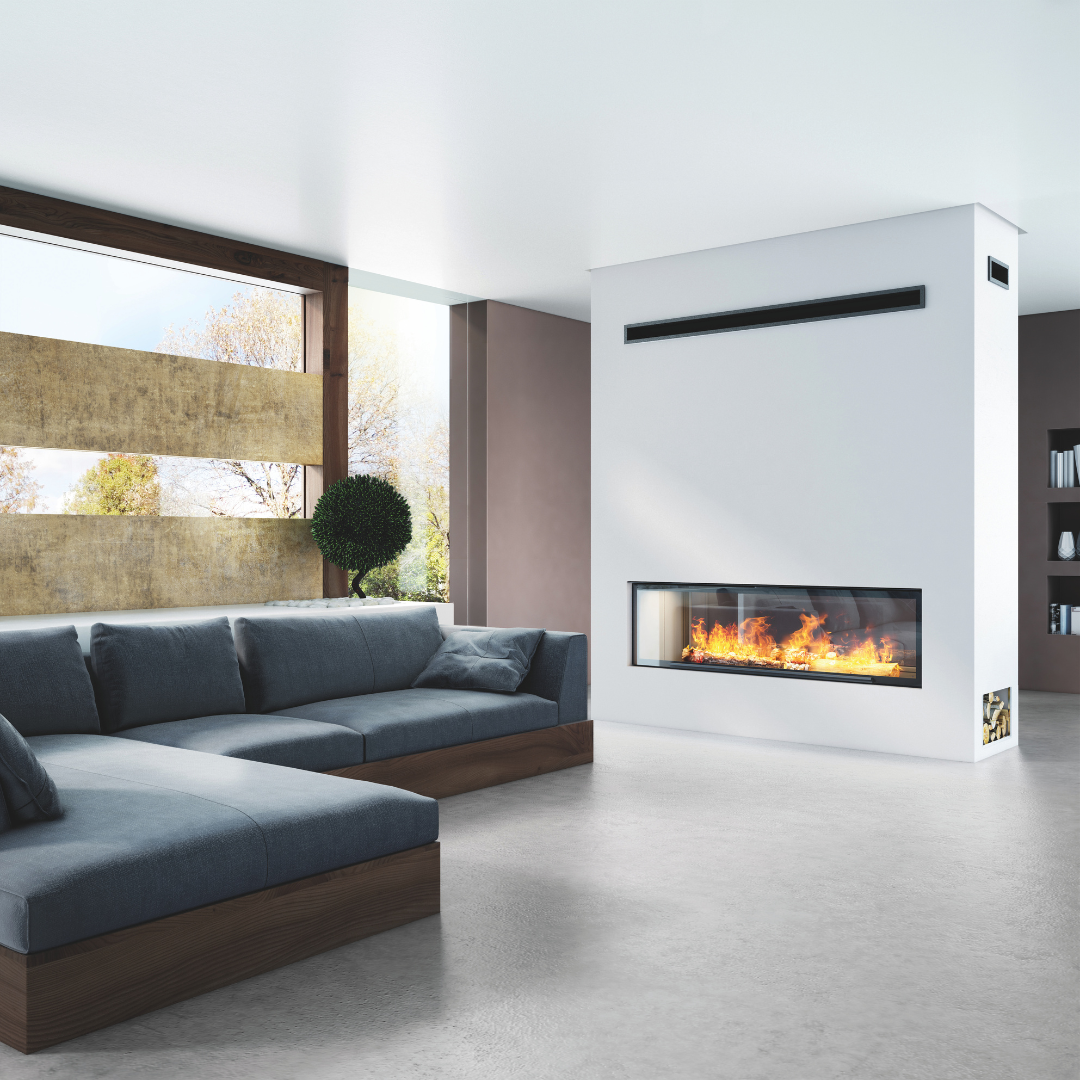 Living Room With a Sectional Sofa and a White Fireplace Glowing With Flames — Complete Heating In Huntingfield, TAS