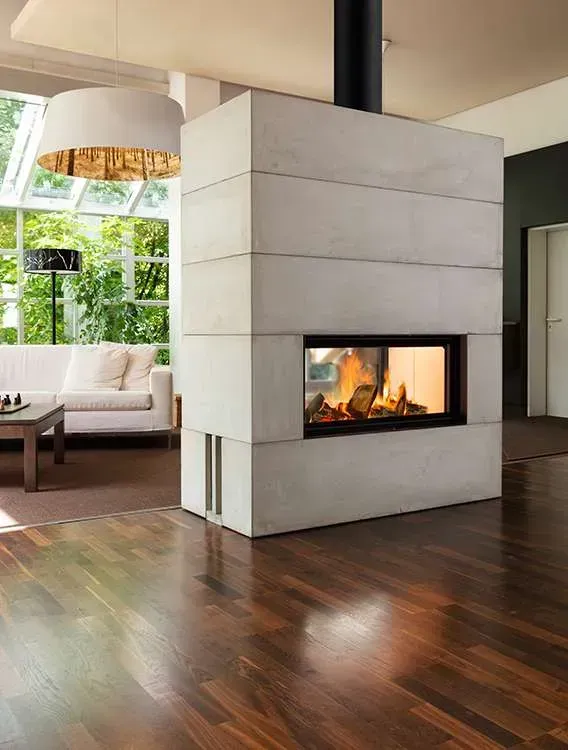 Living Room With a White Fireplace, Dark Wood Floors, and a View of a Sofa — Complete Heating In Huntingfield, TAS