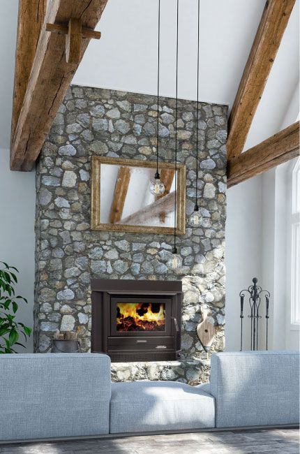 Stone Fireplace With a Lit Fire, Wooden Beams, and a Grey Sofa — Complete Heating In Huntingfield, TAS