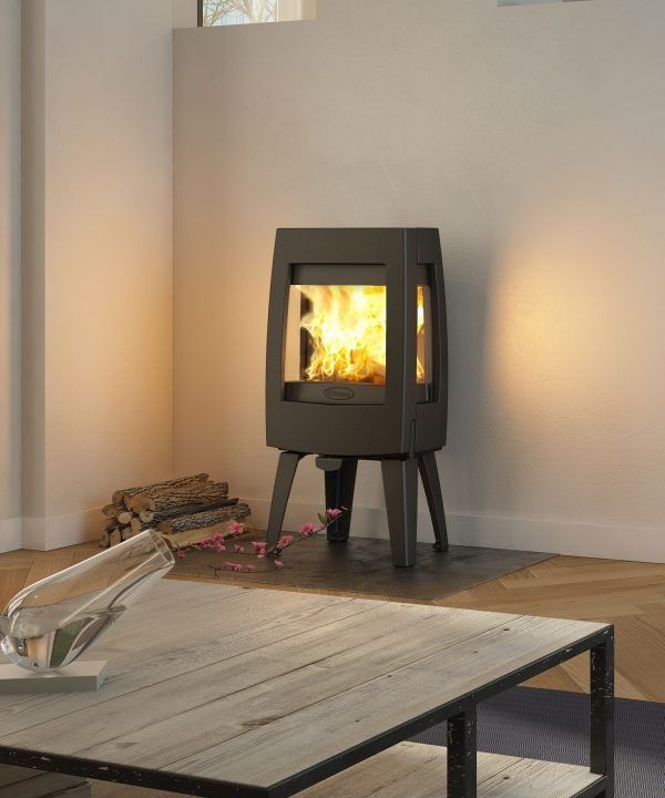 Black Wood-burning Stove Burning in a Minimalist Room — Complete Heating In Huntingfield, TAS