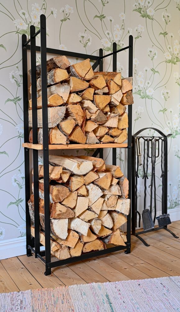 A Metal Rack Standing Next to a Fireplace Tool Set — Complete Heating In Huntingfield, TAS