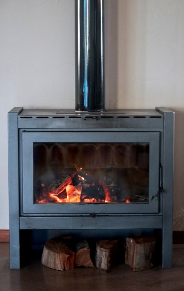 A Grey Metal Wood-burning Stove — Complete Heating In Huntingfield, TAS