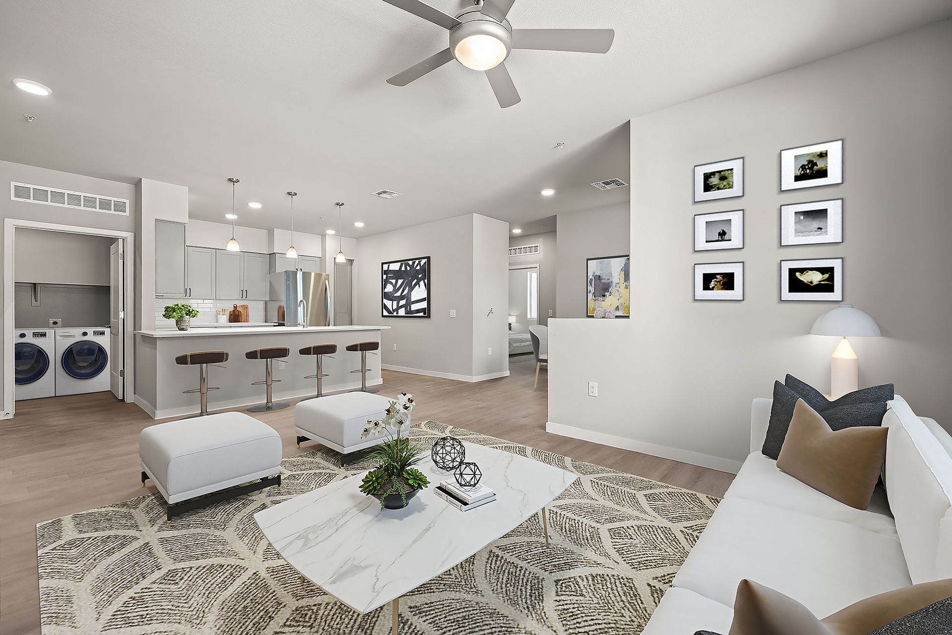 A living room with a ceiling fan and a couch