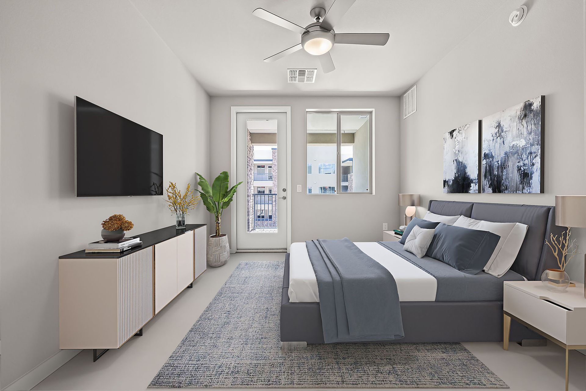 A bedroom with a bed , television , nightstand and ceiling fan.