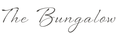 “The Bungalow” in elegant gray cursive script on a white background