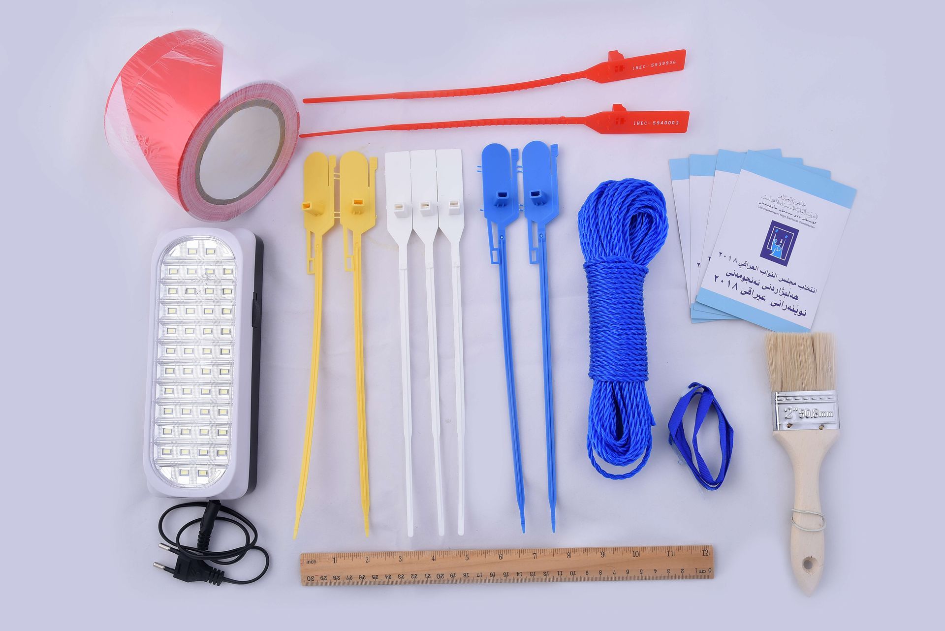 A bunch of tools including a brush and a ruler