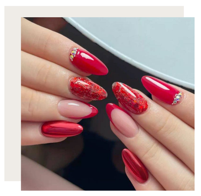Hands display almond-shaped nails in various red styles: glossy, glittery, chrome, and French tip with crystal accents.