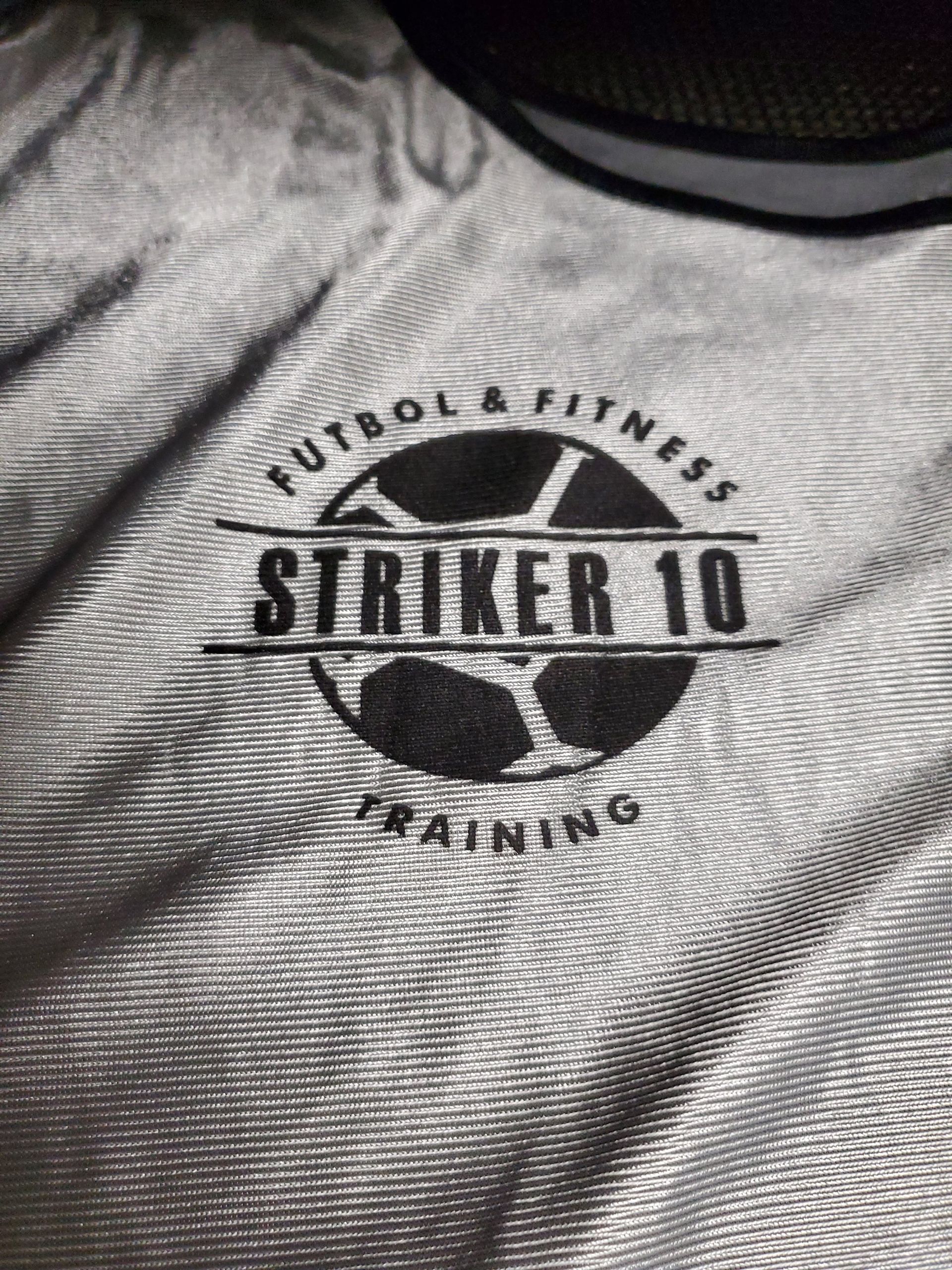 A close up of a shirt that says ' striker 10 ' on it