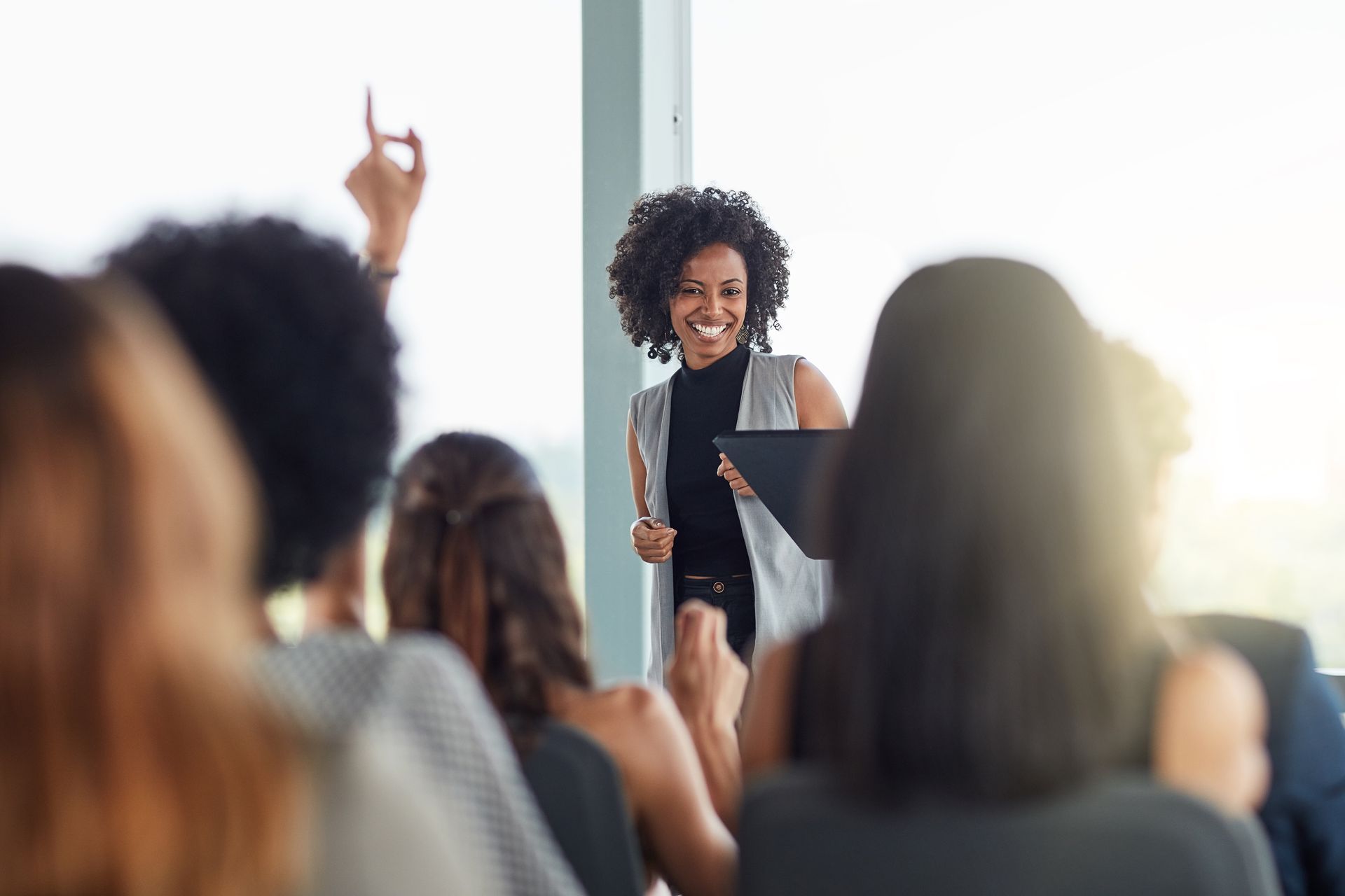 Woman presenting to a seated group
